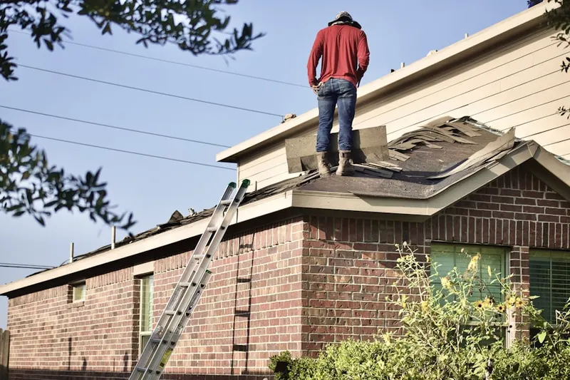 Professional roofer working on a residential roof in Fox Valley